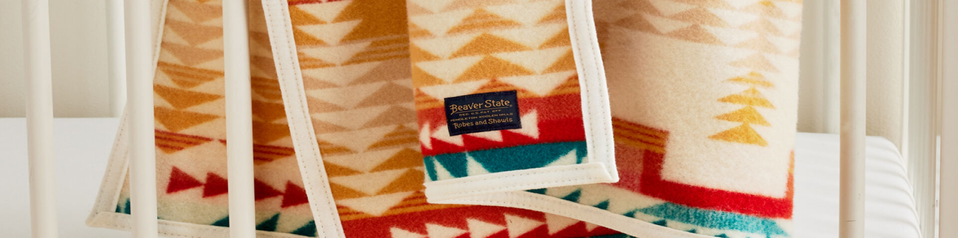 Close up of Shared Paths Crib Blanket