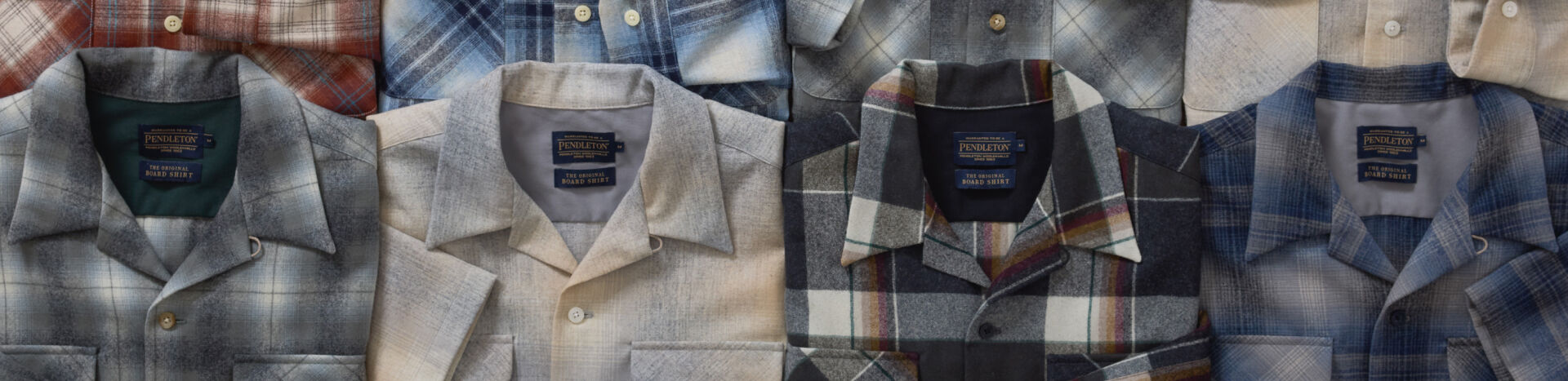 Stack of Mens Board Shirts Showing Variety of Patterns