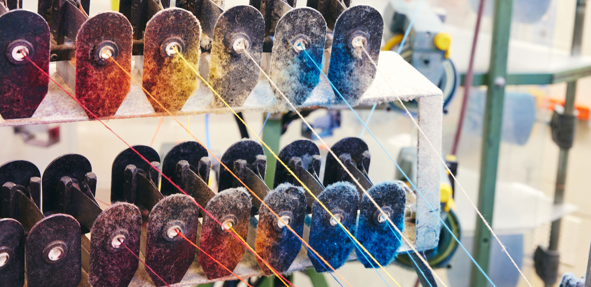 Spools of wool thread on loom