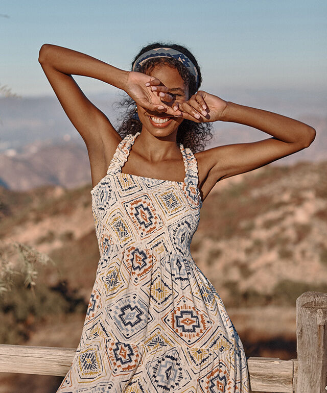 Woman standing outside smiling in Pendleton sun dress
