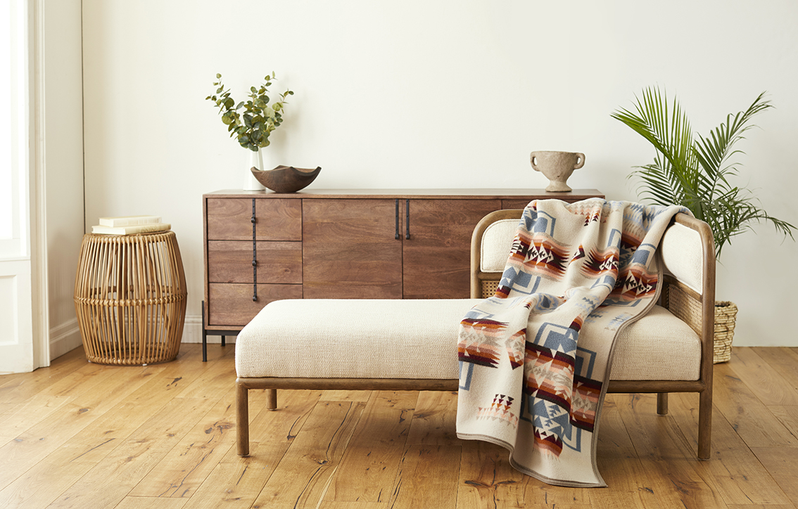 The Pendleton Chief Joseph blanket in Rosewood, in a living room.