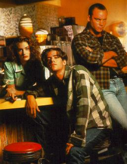 shelley_bobby_and_leo in the Diner, wearing plaid Pendleton.