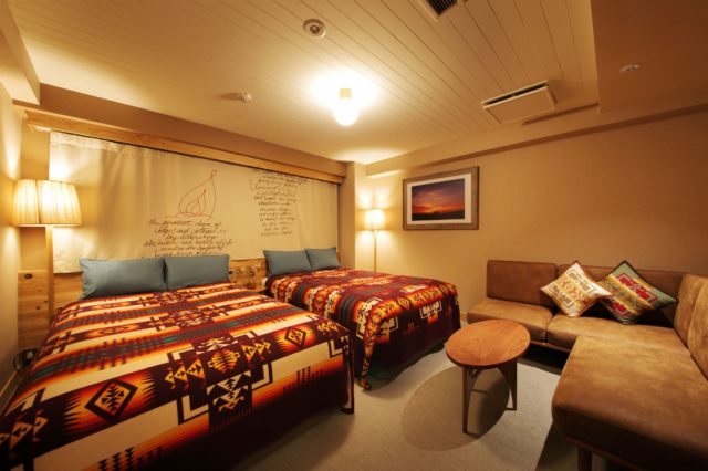 Another room at Hotel Unwind in Sapporo, Japan, featuring Pendleton Chief Joseph blankets and pillows.