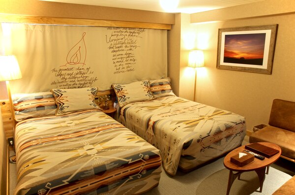 A room at Hotel Unwind in Sapporo, Japan, featuring a White Sands Pendleton blankets and pillow shams.