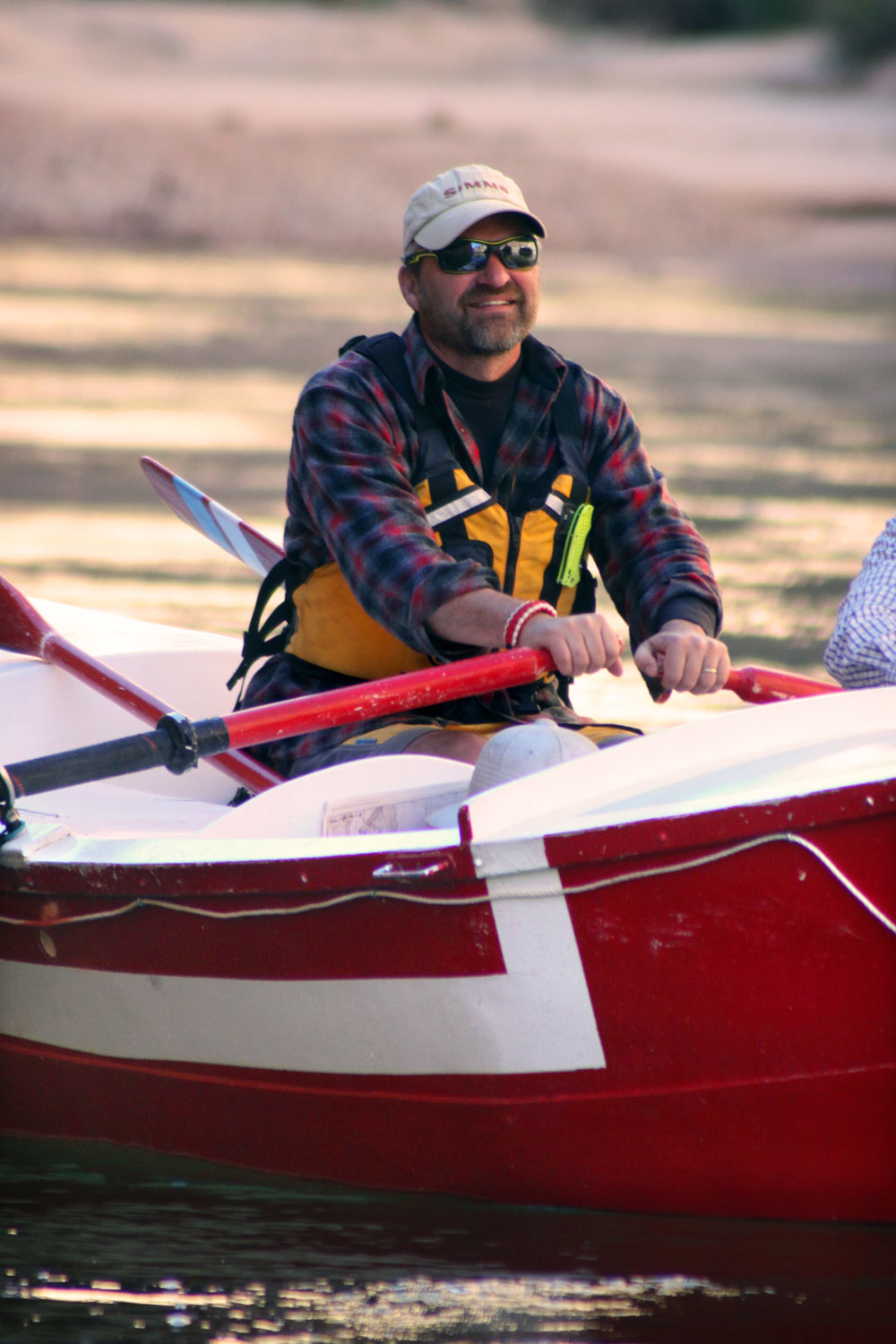 Greg Hatten, river guide extraordinaire, in his wooden boat. Greg is also wearing a Pendleton shirt.