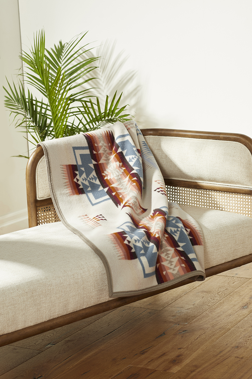 Closer view of tPendleton Chief Joseph blanket in Rosewood, in a living room.