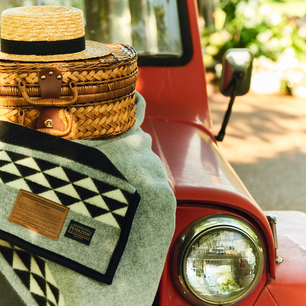 Taylor_Colson_Horton_Cameron_Powell shot of a red vehicle, blanket and basket.