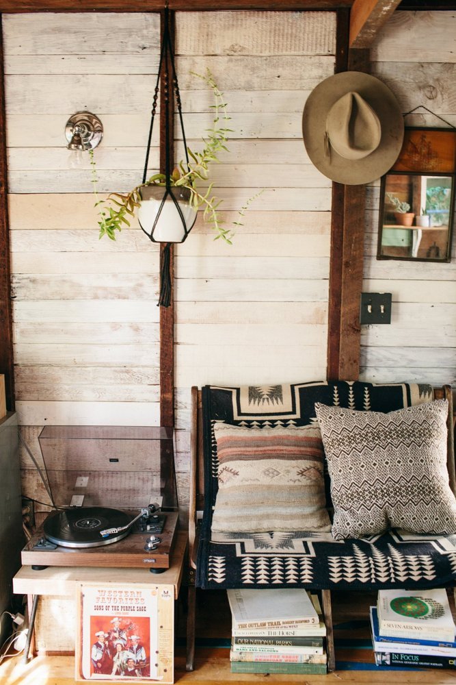 A couch covered in a Pendleton blanket.