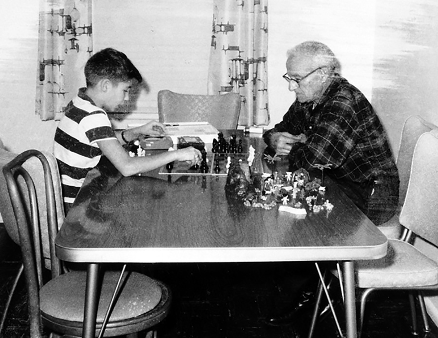 Charles Kramer and a grandson playing chess