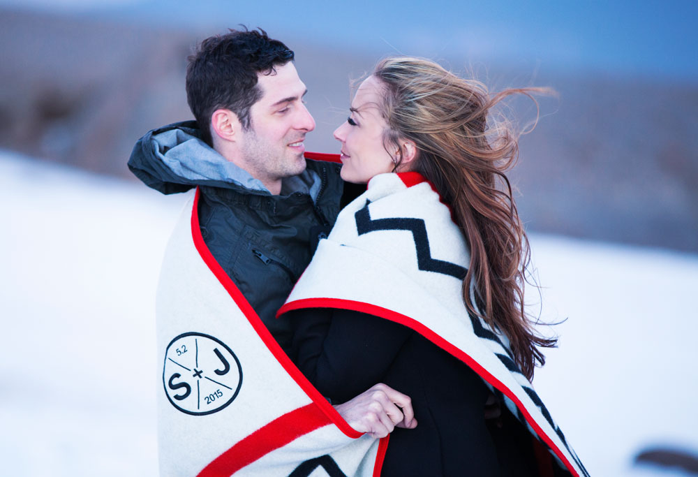 Sarah and Jeffrey on the snowy slopes of Mt Hood, wrapped in a Friends of Timberline blanket.