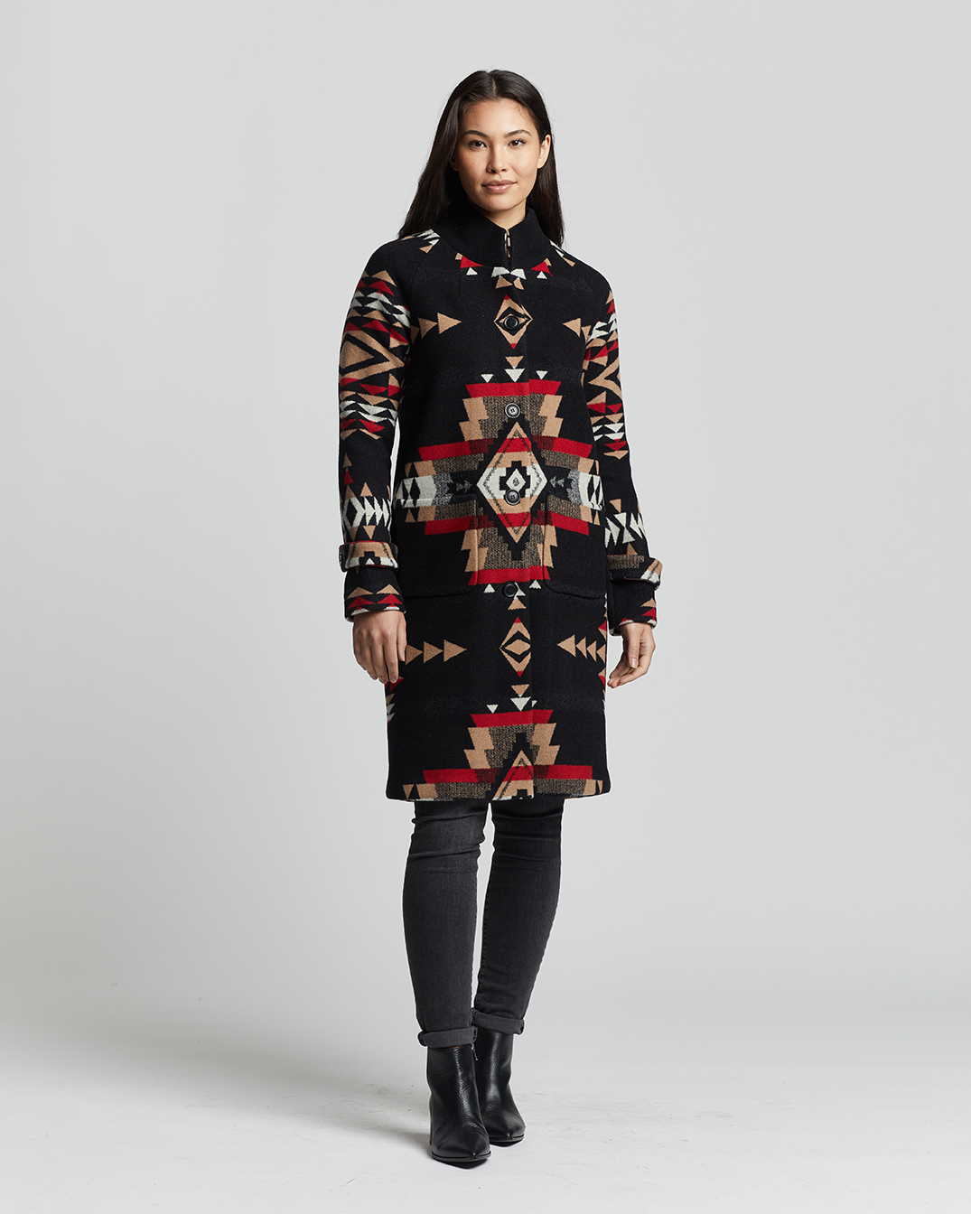 A woman with long dark hair wears the Pendleton Archive Coat.