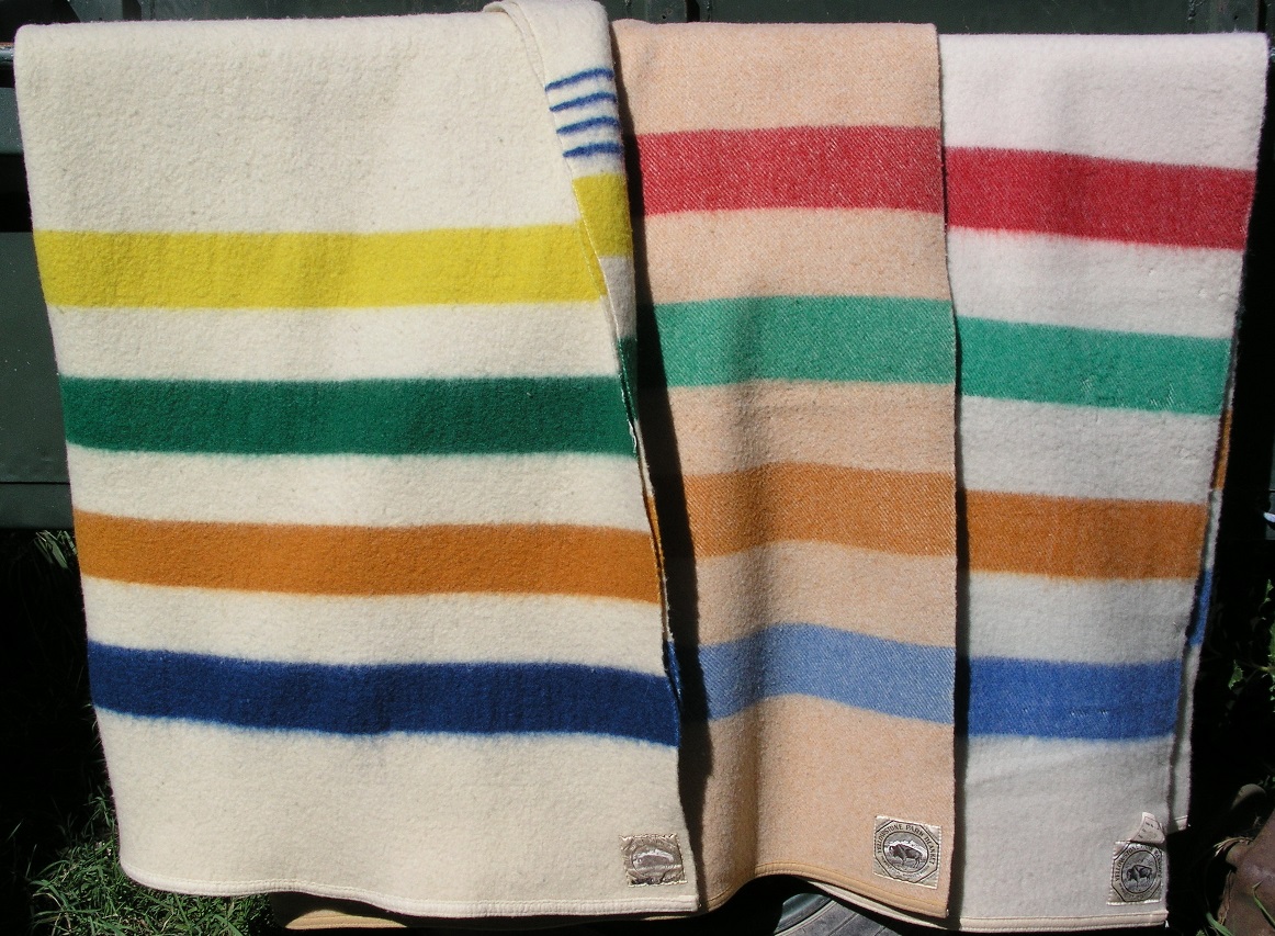 Three early Yellowstone blankets with buffalo labels