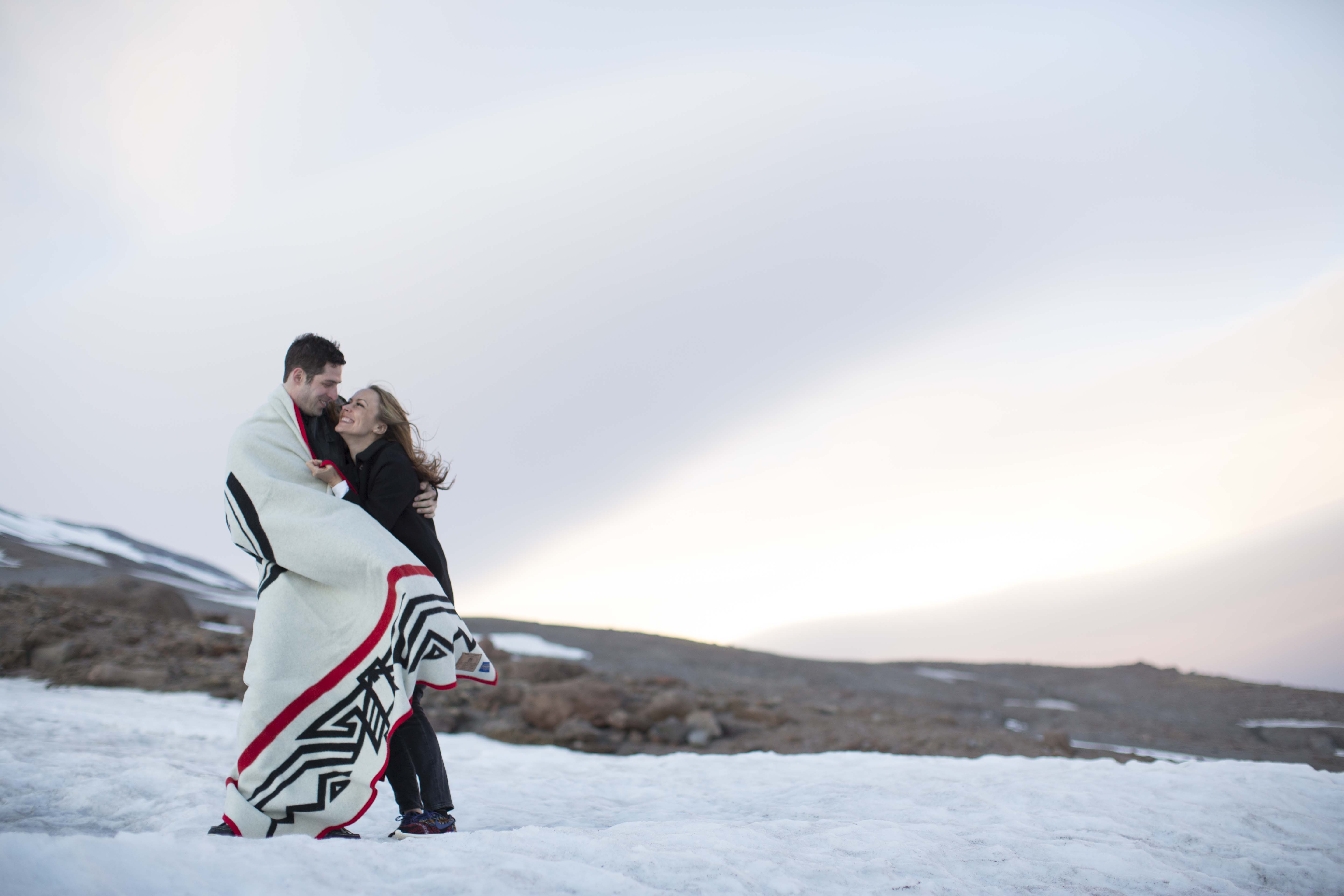 Sarah and Jeffrey on the snowy slopes of Mt Hood, wrapped in a Friends of Timberline blanket.
