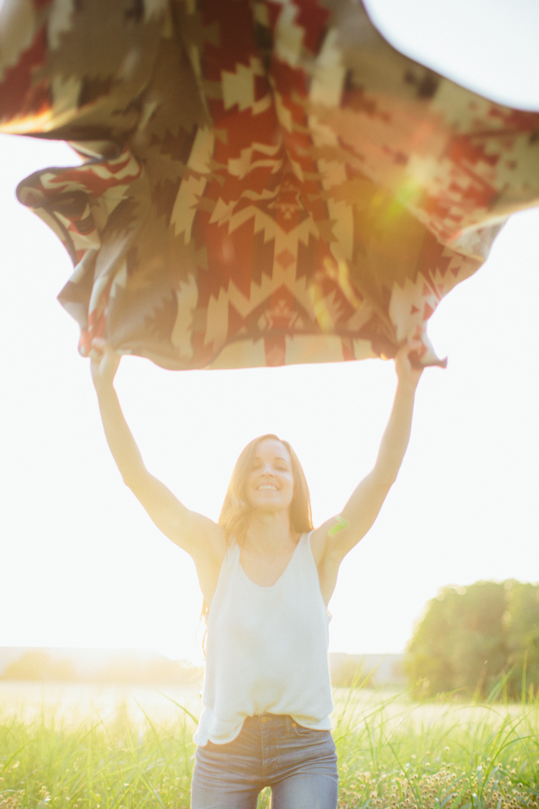 A young woman waves a Mountain Majesty