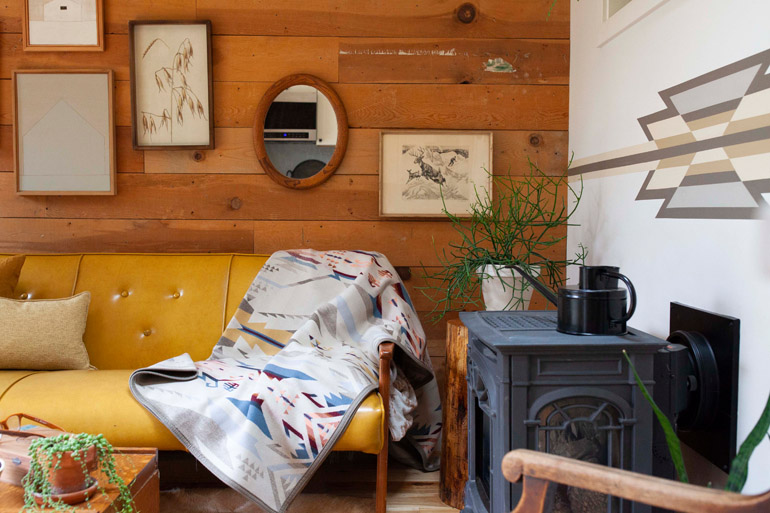 A Pacific Northwest living room in earthy neutral tones featuring the White Sands Pendleton blanket. Photo by Oregon home magazine, used with permission.