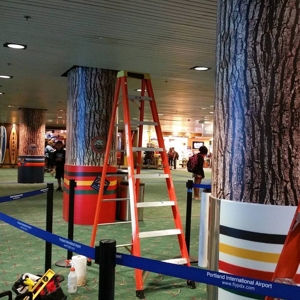 PDXForest - columns wrapped with Park Stripes and bark